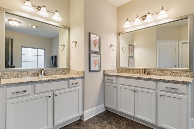 118 Newnham Bridge Dr, Nolensville, TN 37135 - bathroom featuring two vanities, tile patterned floors, baseboards, and a sink