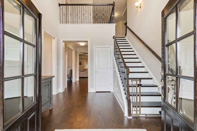 118 Newnham Bridge Dr, Nolensville, TN 37135 - foyer entrance featuring baseboards, a towering ceiling, stairs, and dark wood-style flooring