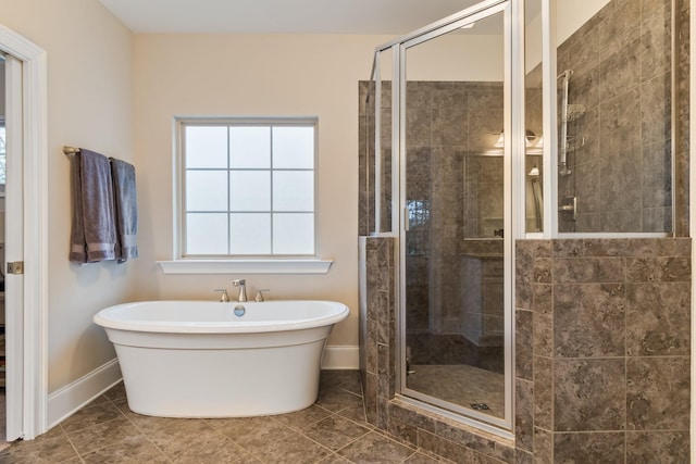 118 Newnham Bridge Dr, Nolensville, TN 37135 - full bath featuring a shower stall, a soaking tub, tile patterned floors, and baseboards