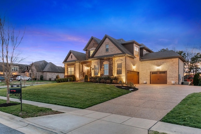 118 Newnham Bridge Dr, Nolensville, TN 37135 - view of front of house featuring a lawn, brick siding, concrete driveway, and a garage