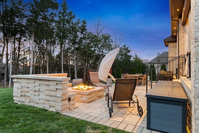 118 Newnham Bridge Dr, Nolensville, TN 37135 - patio terrace at dusk with an outdoor fire pit
