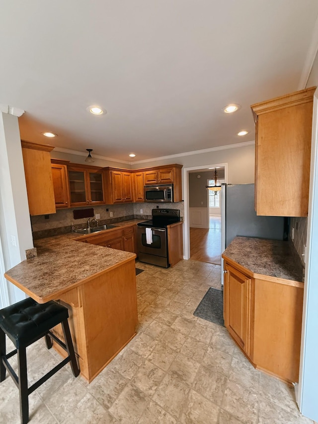 996 Iron Hill Rd, Burns, TN 37029 - kitchen with backsplash, a peninsula, stainless steel microwave, brown cabinetry, and electric range