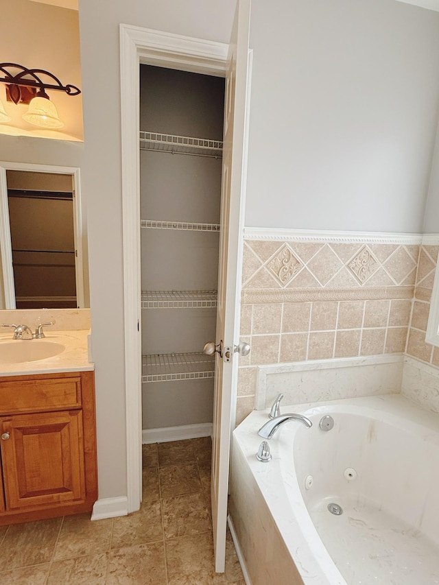 996 Iron Hill Rd, Burns, TN 37029 - full bathroom with tile patterned floors, vanity, and a jetted tub