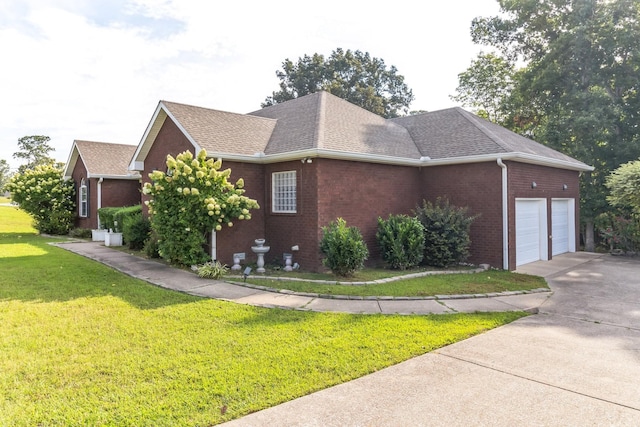 996 Iron Hill Rd, Burns, TN 37029 - view of side of home with concrete driveway, roof with shingles, brick siding, a garage, and a lawn