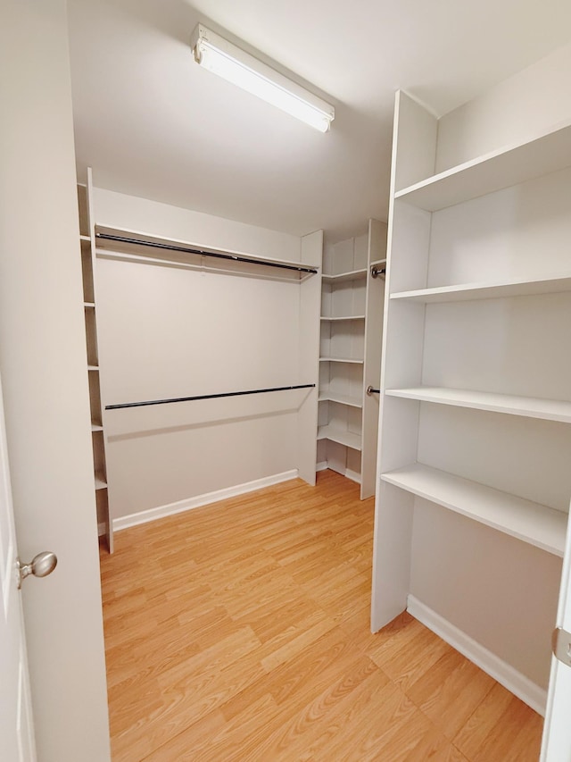 996 Iron Hill Rd, Burns, TN 37029 - spacious closet with light wood-type flooring