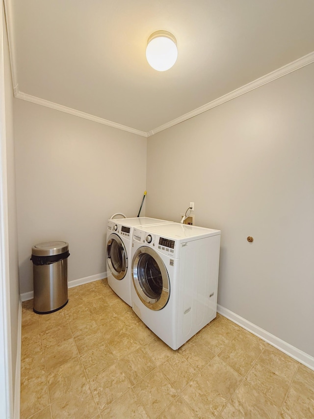 996 Iron Hill Rd, Burns, TN 37029 - clothes washing area with washing machine and clothes dryer, ornamental molding, baseboards, and laundry area