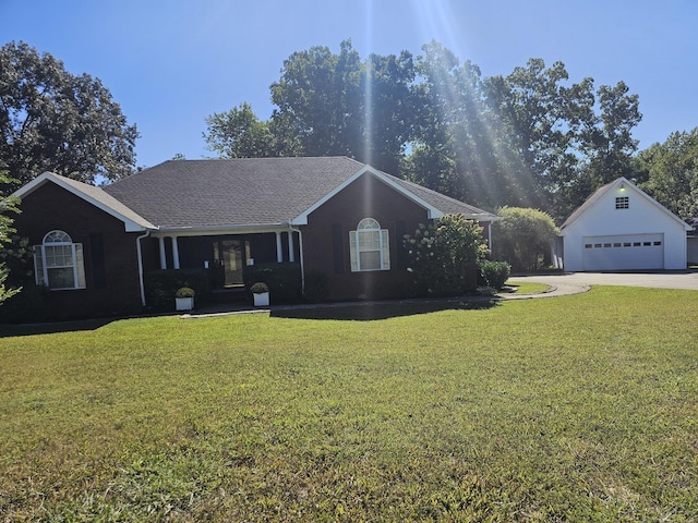996 Iron Hill Rd, Burns, TN 37029 - ranch-style home featuring an outdoor structure, a detached garage, and a front lawn