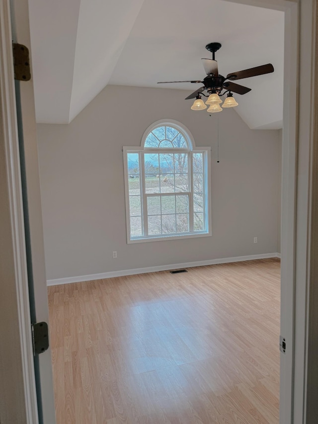 996 Iron Hill Rd, Burns, TN 37029 - spare room featuring visible vents, light wood-style flooring, and lofted ceiling