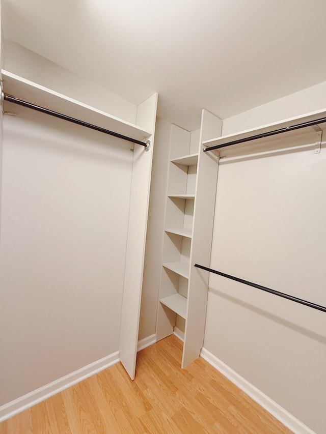 996 Iron Hill Rd, Burns, TN 37029 - spacious closet featuring light wood finished floors
