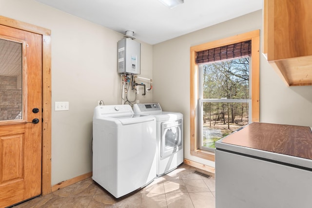 12112 Paw Paw Springs Rd, Arrington, TN 37014 - clothes washing area featuring water heater, separate washer and dryer, laundry area, baseboards, and visible vents