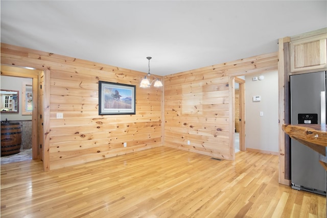 12112 Paw Paw Springs Rd, Arrington, TN 37014 - dining space with wood walls and light wood finished floors