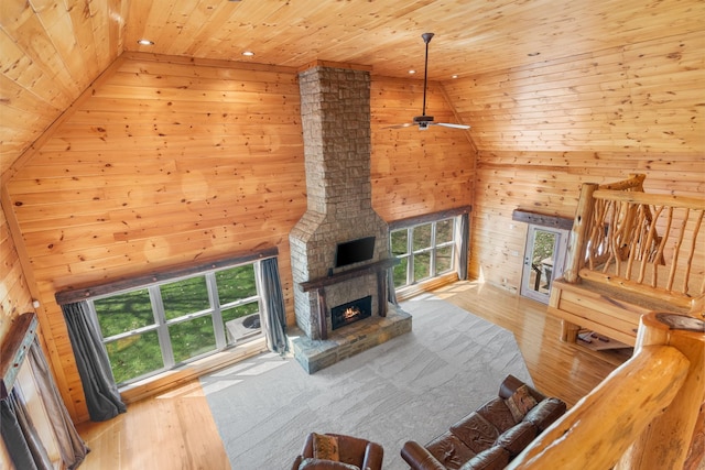 12112 Paw Paw Springs Rd, Arrington, TN 37014 - living room with high vaulted ceiling, wood walls, wood ceiling, and plenty of natural light