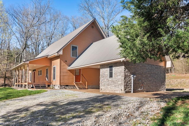 12112 Paw Paw Springs Rd, Arrington, TN 37014 - exterior space featuring crawl space, metal roof, stone siding, and driveway