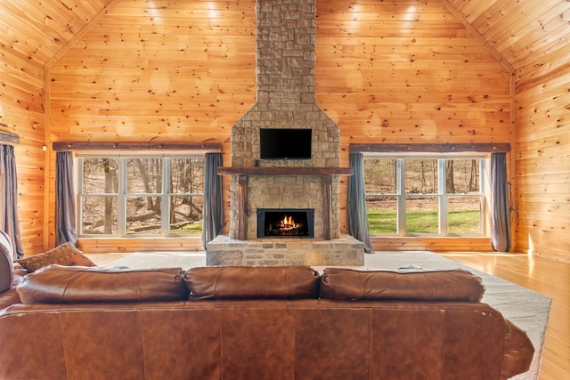 12112 Paw Paw Springs Rd, Arrington, TN 37014 - living area with a fireplace, high vaulted ceiling, wood walls, and wood finished floors