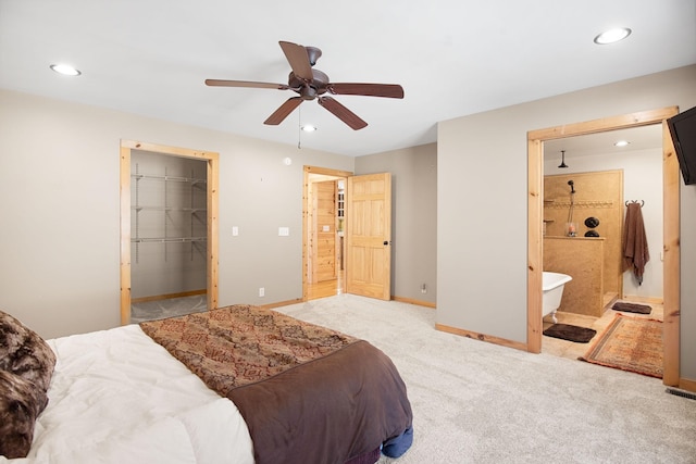 12112 Paw Paw Springs Rd, Arrington, TN 37014 - carpeted bedroom with baseboards, connected bathroom, recessed lighting, a ceiling fan, and a walk in closet