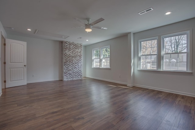 spare room with a ceiling fan, dark wood finished floors, baseboards, attic access, and recessed lighting