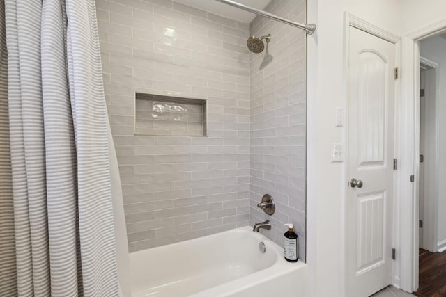 bathroom featuring shower / bathtub combination with curtain