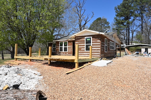 70 Old Bruceton Rd, Bruceton, TN 38317 - view of side of home featuring a detached carport and a deck