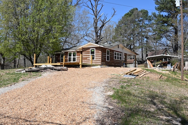 70 Old Bruceton Rd, Bruceton, TN 38317 - view of front of house featuring a carport and a wooden deck