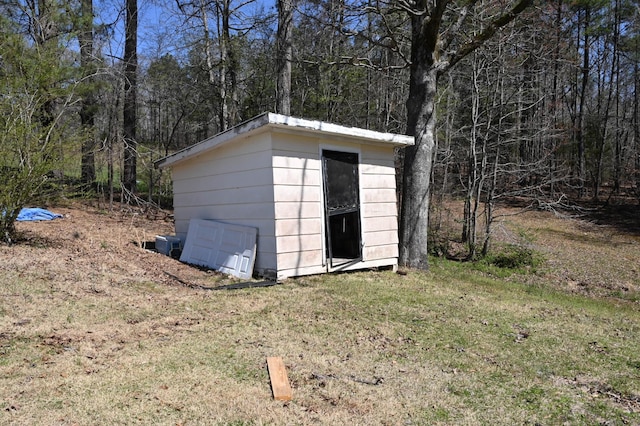 70 Old Bruceton Rd, Bruceton, TN 38317 - view of shed with a wooded view