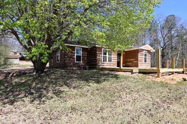 70 Old Bruceton Rd, Bruceton, TN 38317 - view of front facade with a front lawn and a deck