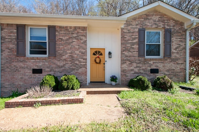 split foyer home featuring brick siding and crawl space