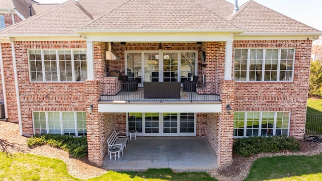 1395 Rozella Way, Gallatin, TN 37066 - back of property featuring a balcony, a patio, brick siding, and roof with shingles