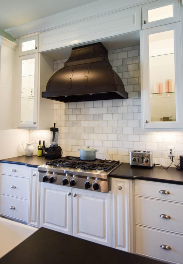 1395 Rozella Way, Gallatin, TN 37066 - kitchen featuring dark countertops, stainless steel gas cooktop, custom exhaust hood, and white cabinets