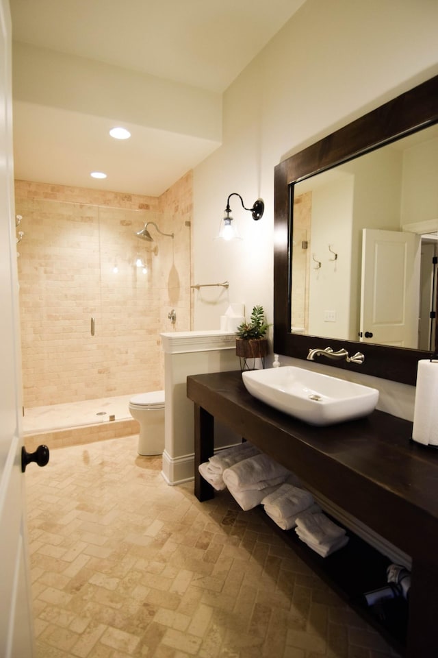 1395 Rozella Way, Gallatin, TN 37066 - bathroom featuring vanity, recessed lighting, toilet, a stall shower, and brick floor