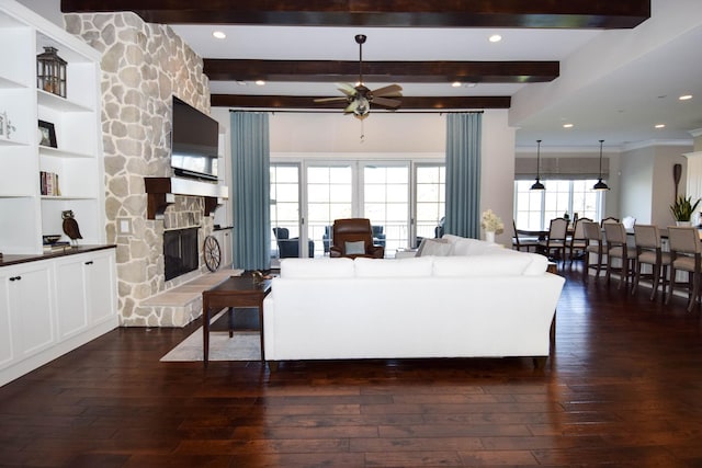 1395 Rozella Way, Gallatin, TN 37066 - living area with beam ceiling, a stone fireplace, dark wood-type flooring, and ceiling fan
