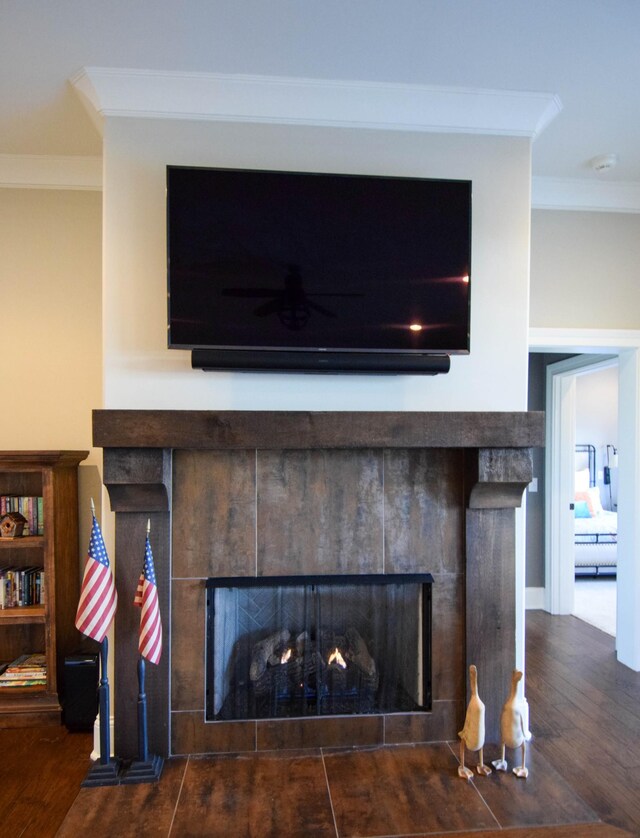 1395 Rozella Way, Gallatin, TN 37066 - interior details with crown molding, a tiled fireplace, and wood finished floors