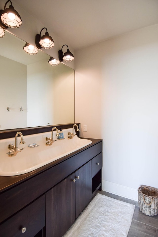 1395 Rozella Way, Gallatin, TN 37066 - bathroom with baseboards, wood finished floors, and vanity