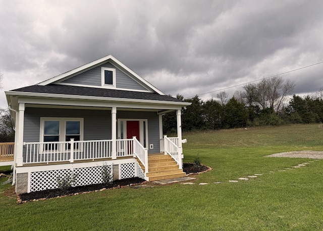 7022 Magnolia Ln, Nunnelly, TN 37137 - view of front of house featuring a porch, a front lawn, and a shingled roof