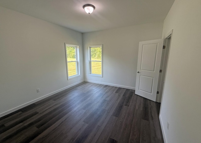 7022 Magnolia Ln, Nunnelly, TN 37137 - empty room with dark wood-type flooring and baseboards