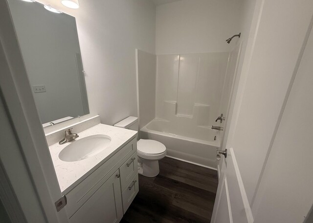 7022 Magnolia Ln, Nunnelly, TN 37137 - full bath featuring vanity, toilet, wood finished floors, and bathtub / shower combination