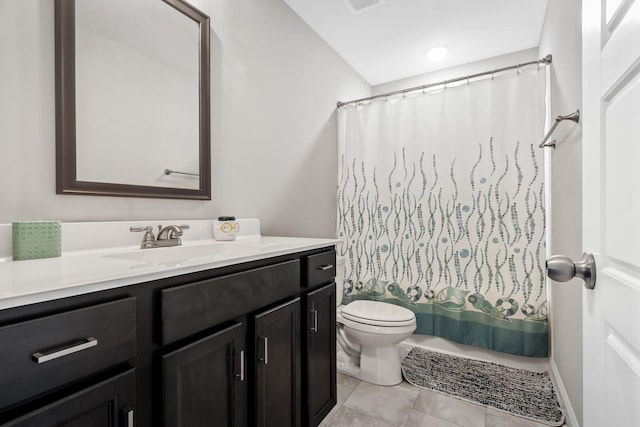 full bathroom with visible vents, toilet, curtained shower, vanity, and tile patterned flooring