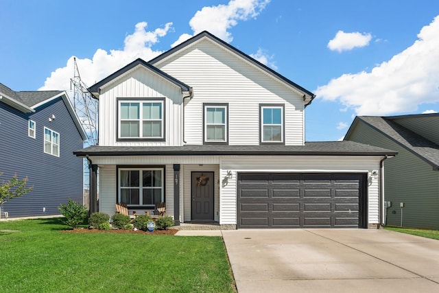 view of front of house featuring a porch, concrete driveway, and a front lawn