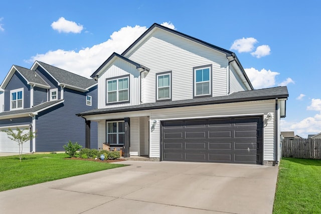 view of front of property with a front yard, concrete driveway, an attached garage, fence, and a porch