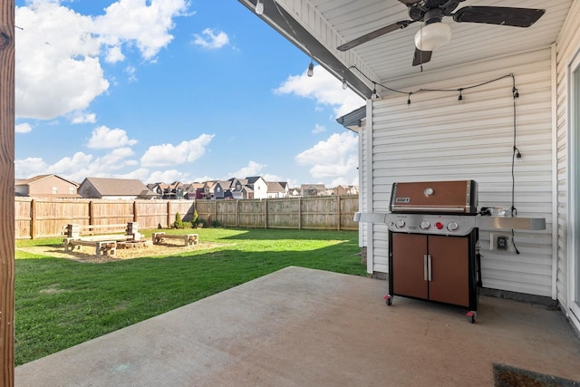 view of patio / terrace featuring a fenced backyard, a residential view, grilling area, a garden, and ceiling fan