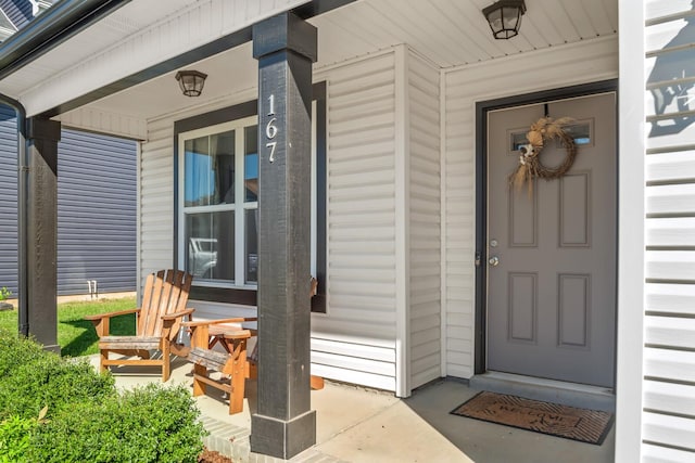 entrance to property featuring a porch