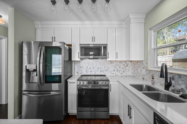1829 Apple Valley Cir, Nashville, TN 37207 - kitchen with white cabinetry, a sink, appliances with stainless steel finishes, and decorative backsplash