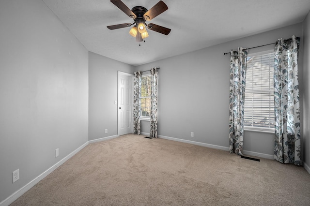 1829 Apple Valley Cir, Nashville, TN 37207 - spare room with baseboards, a ceiling fan, and carpet