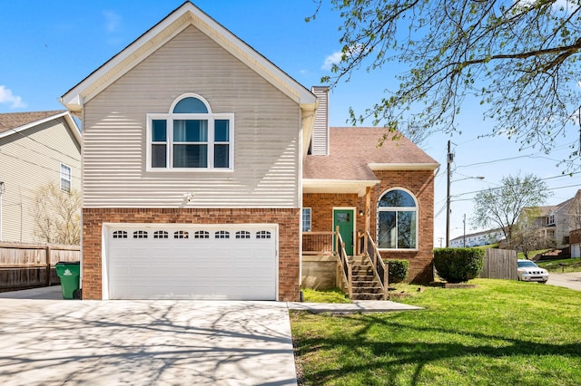 1829 Apple Valley Cir, Nashville, TN 37207 - view of front facade featuring a front yard, concrete driveway, a chimney, fence, and a garage