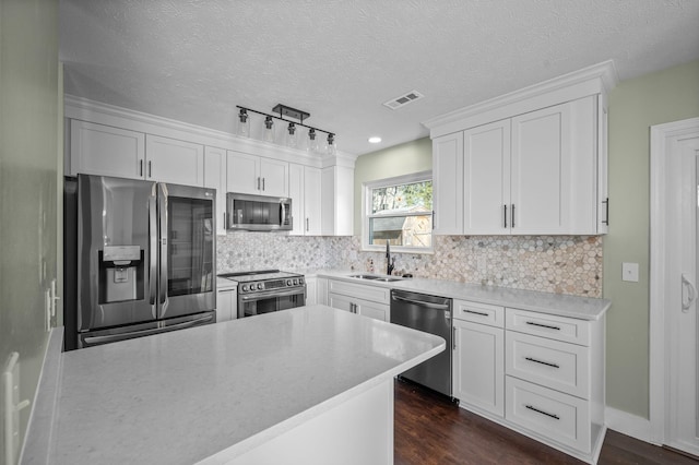 1829 Apple Valley Cir, Nashville, TN 37207 - kitchen featuring backsplash, a sink, stainless steel appliances, and white cabinetry