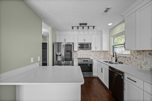 1829 Apple Valley Cir, Nashville, TN 37207 - kitchen with white cabinets, a sink, stainless steel appliances, and tasteful backsplash