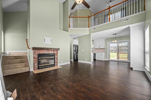 1829 Apple Valley Cir, Nashville, TN 37207 - unfurnished living room with a ceiling fan, dark wood-style flooring, stairs, and visible vents