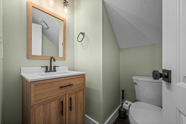 1829 Apple Valley Cir, Nashville, TN 37207 - bathroom featuring toilet, vanity, a textured ceiling, lofted ceiling, and visible vents