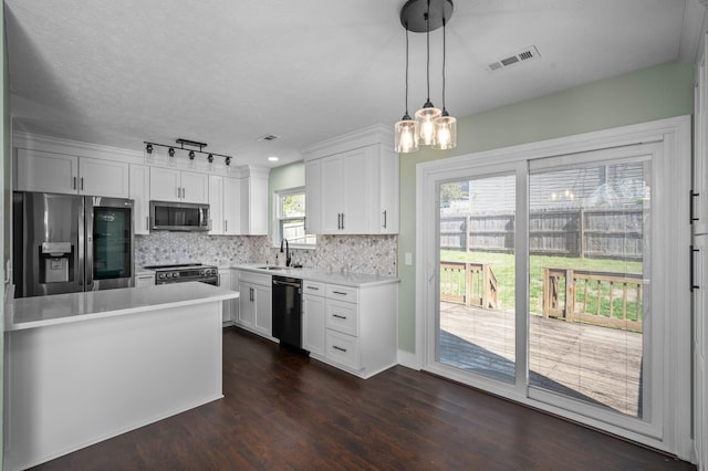 1829 Apple Valley Cir, Nashville, TN 37207 - kitchen featuring light countertops, backsplash, stainless steel appliances, visible vents, and dark wood-type flooring