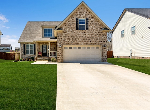 craftsman house featuring fence, an attached garage, driveway, brick siding, and a front yard