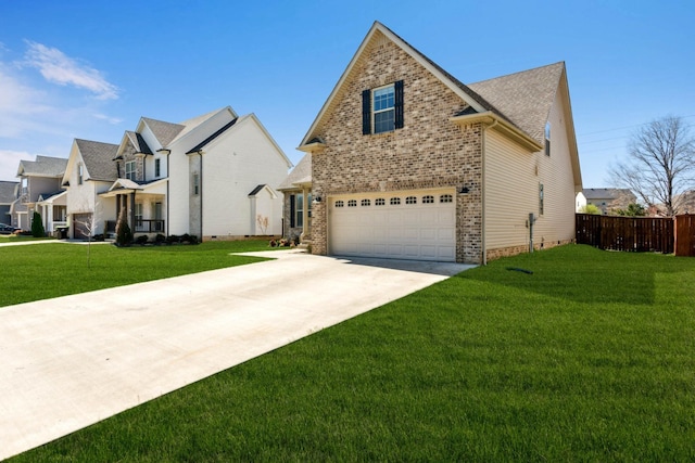 view of front of house featuring an attached garage, a front yard, fence, and driveway
